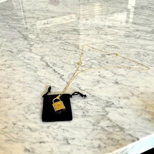 Authentic vintage Louis Vuitton lock that I made into a cool necklace